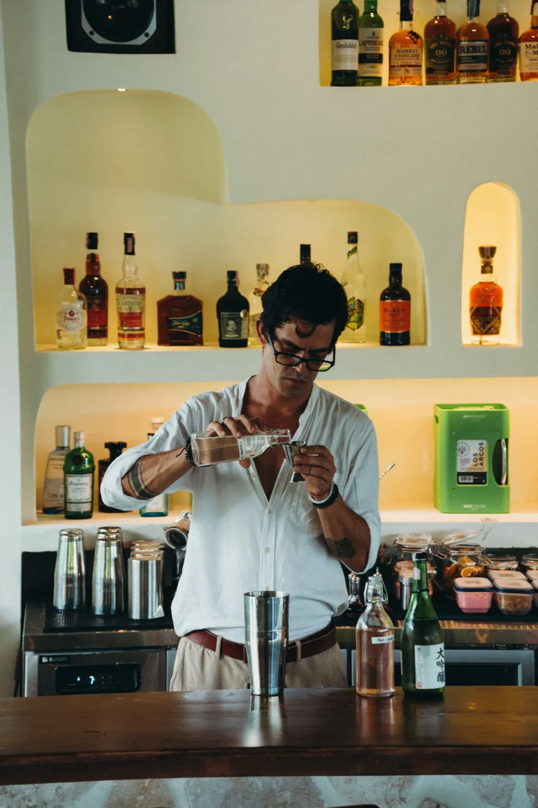 Chris Simon pouring at The Lakehouse bar